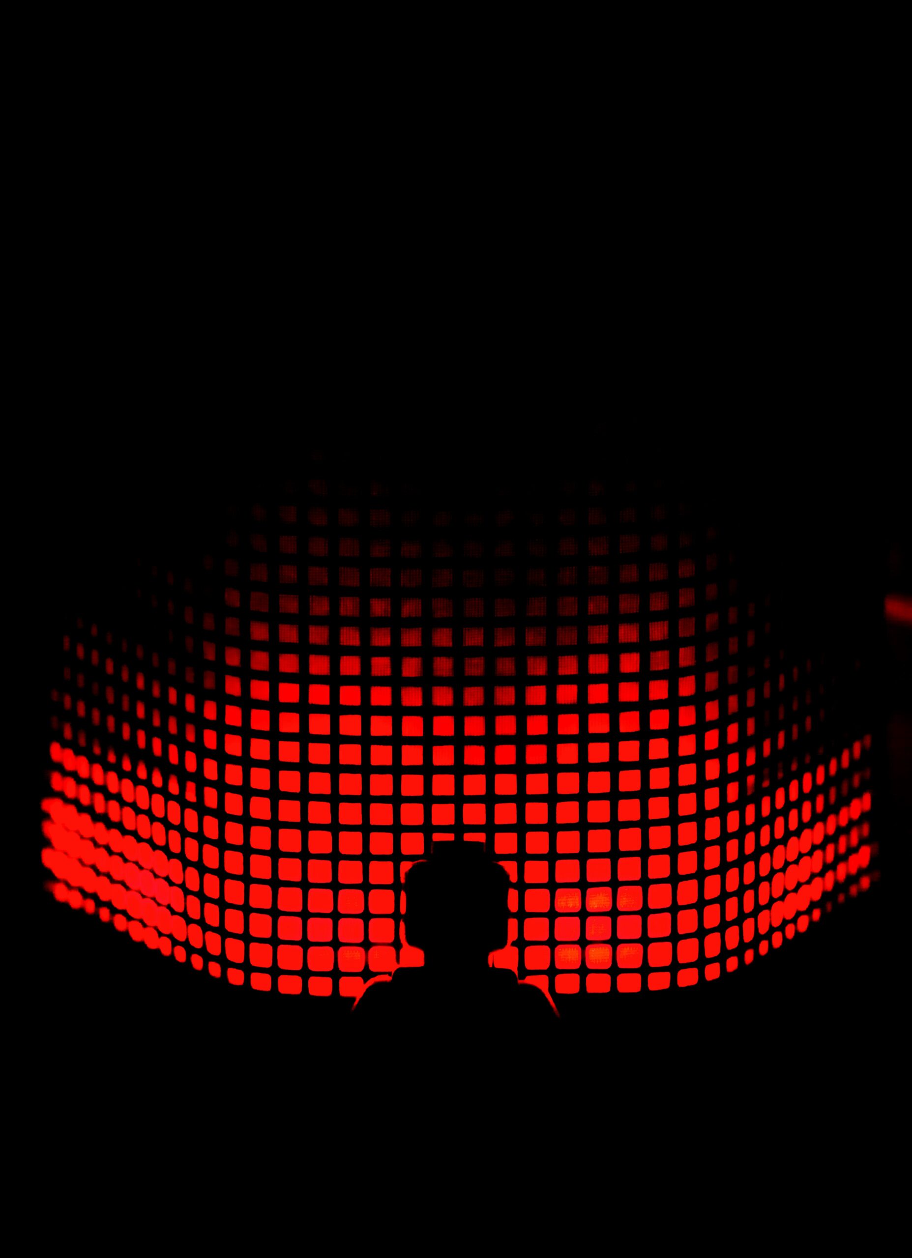 Harnessing Machine Learning to Enhance Your Business: Practical Applications and Real-World Examples a person standing in front of a red light