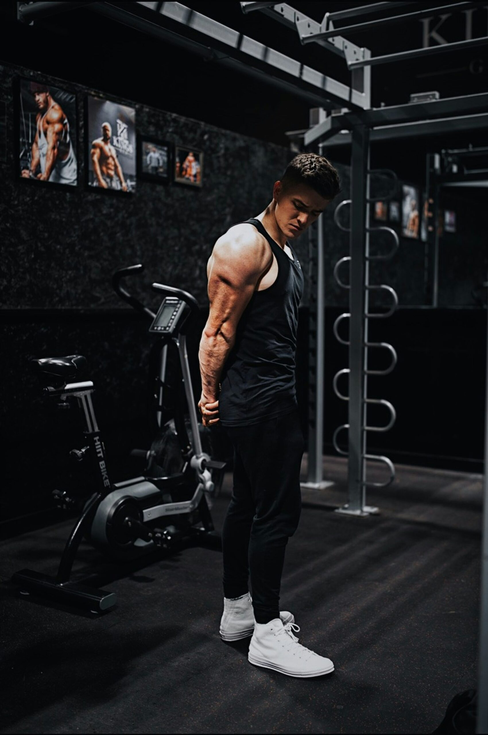 The Top 10 Fitness Trends of the Year: What’s Hot, What’s Not, and What You Need to Know man in black tank top and black pants standing on black exercise equipment