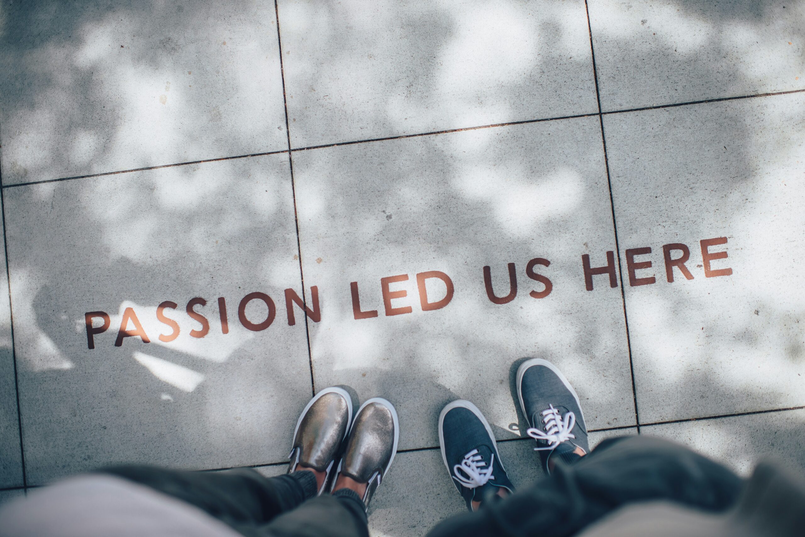 Finding Inspiration in the Unlikely: How to Spot Creative Gems in Unexpected Places two person standing on gray tile paving